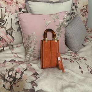Elegant Orange Handbag with Brown Accents